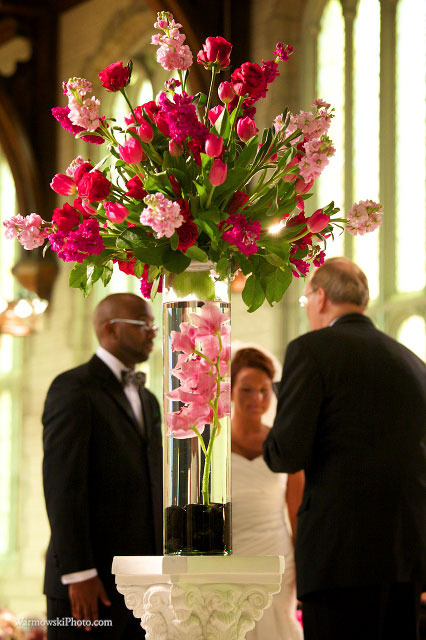 Orchids in the vases by the altar, by Rachel Roman Speh.