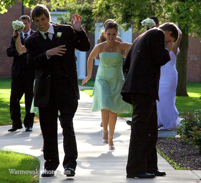 As soon as Julie and Phil's wedding party got out of the limo to take photos at Illinois College, they were swarmed by buffalo gnats.