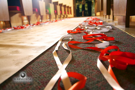 Ribbons decorate the center aisle at a wedding at First Christian Church in 