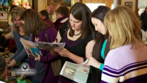 Filling out cards, registering for give-aways at Rushville bridal expo. Warmowski Photography