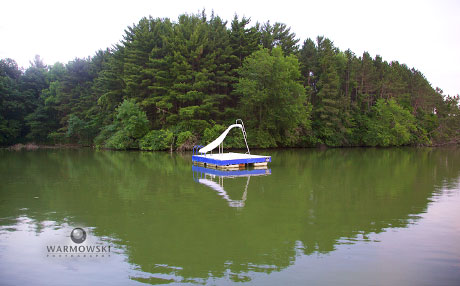 Western Illinois Youth Camp available for weddings, tree-lined lake with floating slide, WarmowskiPhotography.com