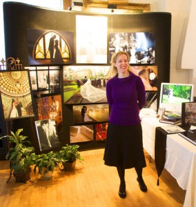 Tiffany Warmowski in front of trade show booth