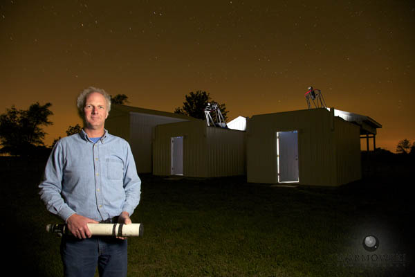 Robert E. Holmes with his first telescope and his latest telescopes he uses to track objects for NASA at Astronomical Research Observatory. 