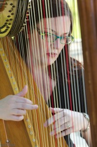 Devon Haupt of The Classic Harpist performs at a wedding at the Washington Park gazebo in Springfield.