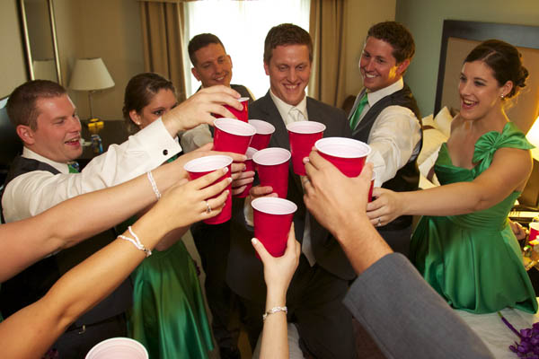 Wedding party toast in the bridal suite, before the reception at Bloomington Holiday Inn.