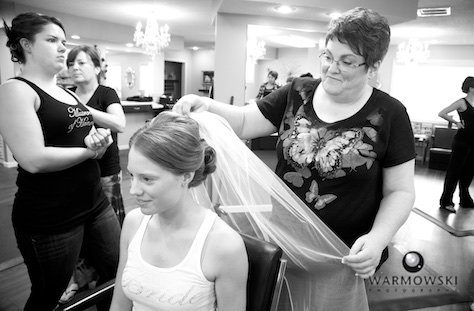 Amanda's mom adjusts veil, at A Hair Company beauty salon in Jacksonville, Illinois. Photo by Steve & Tiffany of Warmowski Photography.