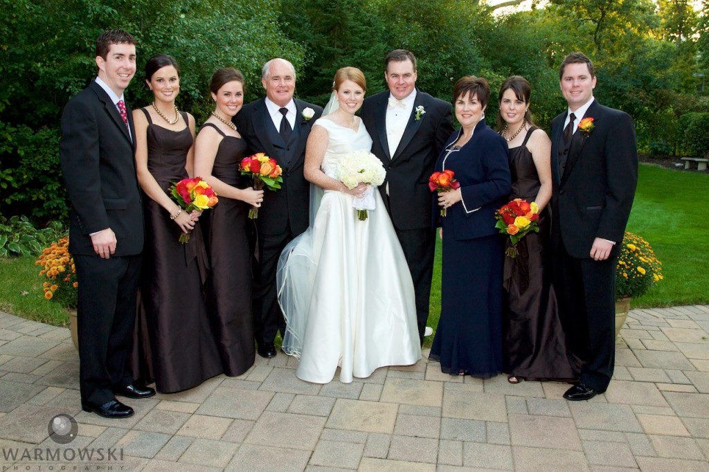 Family photo during the wedding of Elizabeth's sister, Meghan, in 2008. Portraits also in back yard and wedding reception at Crystal Tree Golf and Country Club in Orland Park. Megan has her wedding at St. Michael's Church, Orland Park (the church was under renovation so Elizabeth chose St. Rita of Cascia Shrine Chapel in Chicago for her ceremony.) Wedding photography by Tiffany & Steve Warmowski.