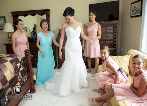 Emi gets ready at her family's Lake Geneva condo. Wedding photography by Steve & Tiffany Warmowski