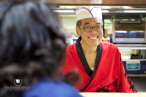 Hiro working the counter, Happy Sushi in Springfield. Wedding photography by Steve of Warmowski Photography.