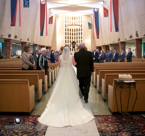 Elizabeth walks down the aisle with her father, St. Rita of Cascia Shrine Chapel in Chicago. Wedding photography by Tiffany & Steve & Warmowski.