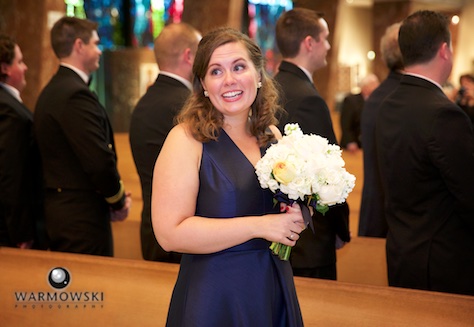 Daniel's sister watches Daniel's reaction as he sees his bride for the first time on their wedding day. Ceremony at St. Rita of Cascia Shrine Chapel in Chicago. Wedding photography by Tiffany & Steve & Warmowski.