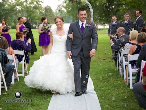 Amanda & Nick coming down the aisle, outdoor wedding ceremony at the Jacksonville Country Club. Photo by Steve & Tiffany of Warmowski Photography.