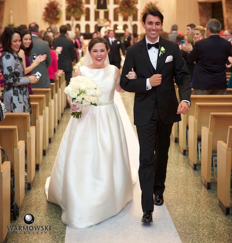 Elizabeth & Daniel exit ceremony at St. Rita of Cascia Shrine Chapel in Chicago. Wedding photography by Tiffany & Steve & Warmowski.
