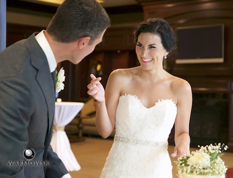 Cutting the cake, reception at Geneva National Golf Club. Wedding photography by Steve & Tiffany Warmowski