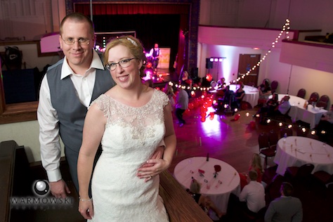 Amy & Ryan at the end of the evening with the Hoogland Center for the Arts decorated for their wedding. Wedding photography by Tiffany & Steve of Warmowski Photography.