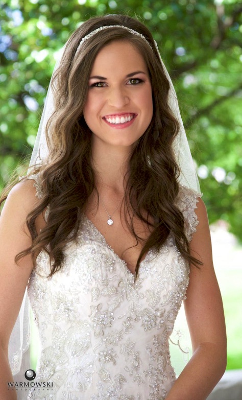 Alissa outside on the porch of the Old Rectory, Our Saviour Catholic Church in Jacksonville. Wedding photography by Tiffany & Steve Warmowski.