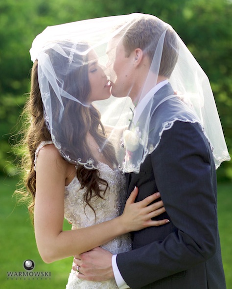 Alissa & Brandon during their outdoor portrait session on their wedding day in Jacksonville. Ceremony at Our Saviour Catholic Church; outdoor portraits and limousine ride to/from the house of Alissa's sister in rural Jacksonville; reception at Hamilton's 110 North East. Wedding photography by Tiffany & Steve Warmowski.